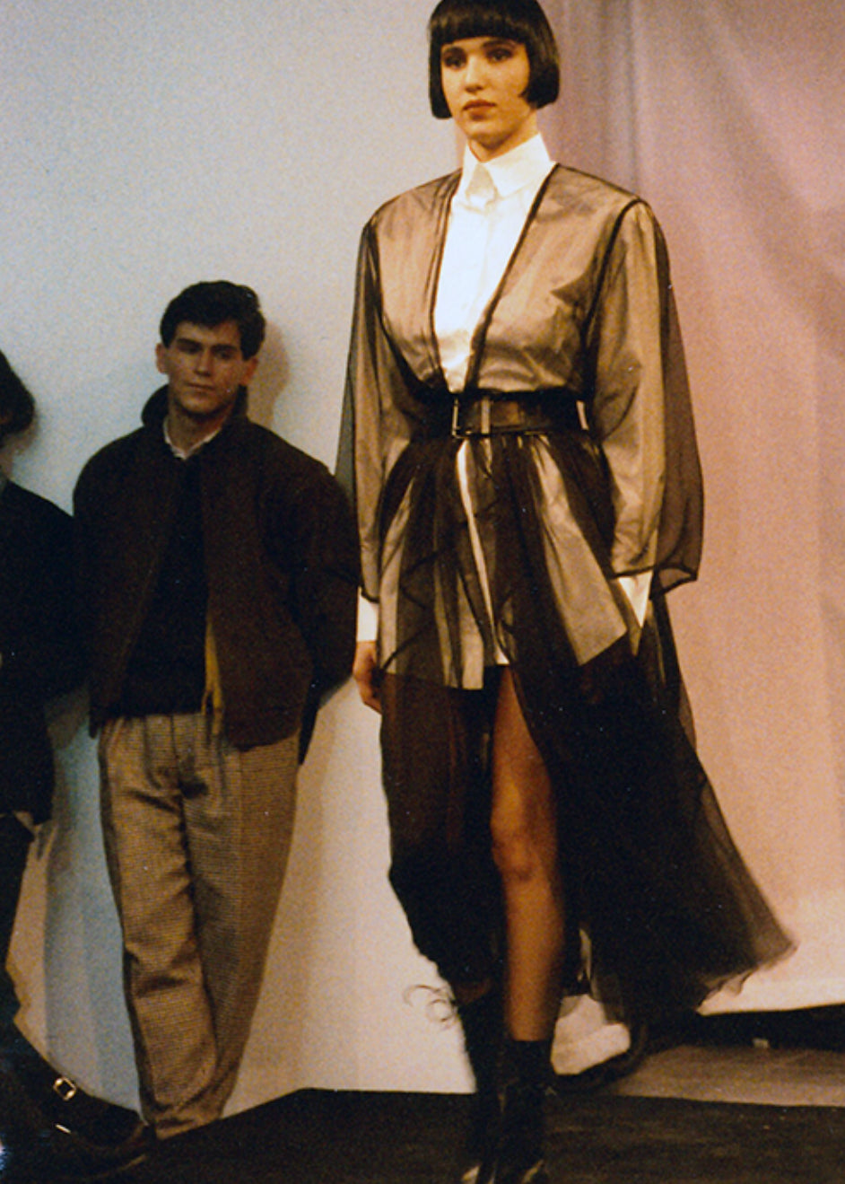 Model wearing vintage Alaïa wide black leather belt on Fall/Winter 1987 runway, full distance shot
