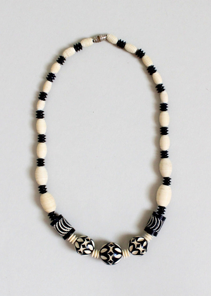 1930s carved celluloid necklace