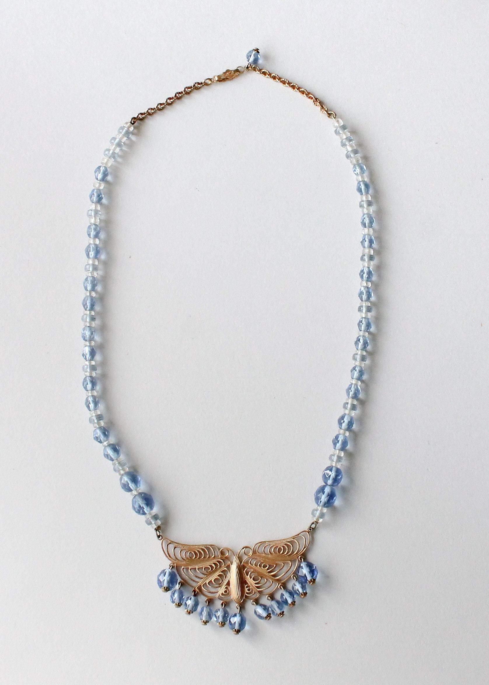 Vintage 1930s Blue Beaded Necklace with Brass Butterfly