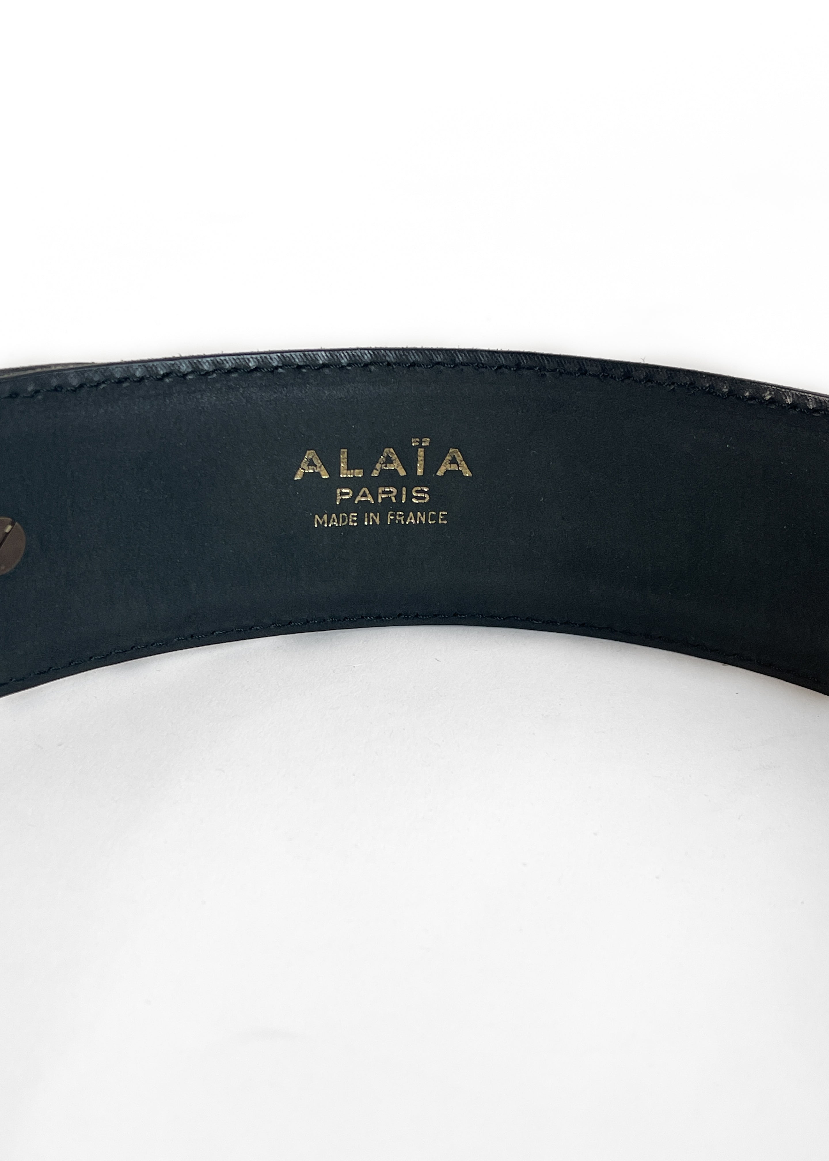 Stamped Alaïa Paris logo on interior of vintage 1987 black leather wide belt