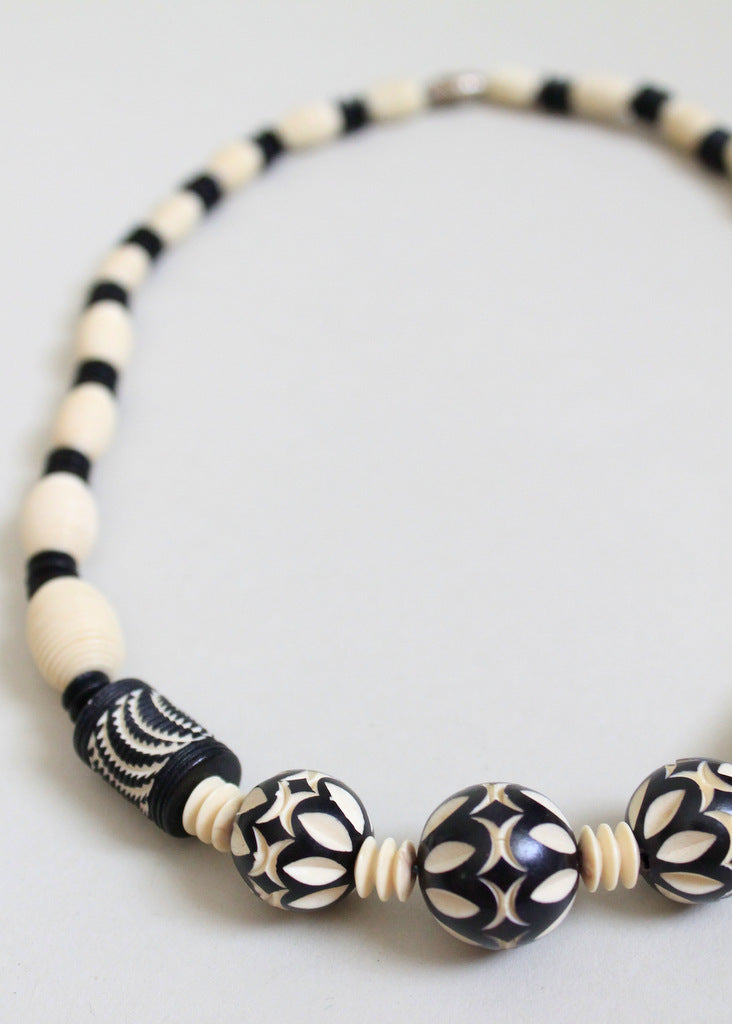 Painted and carved celluloid necklace