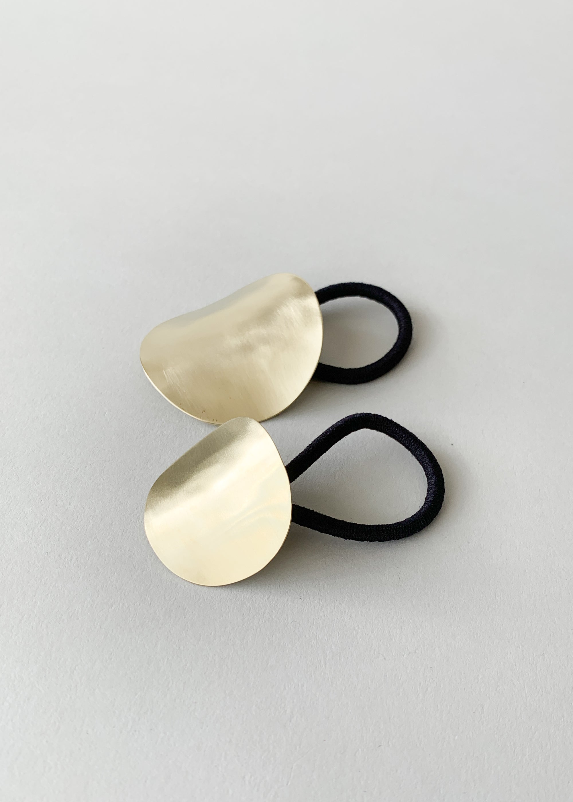 Sculpted Oval Brass Ponytail Holder